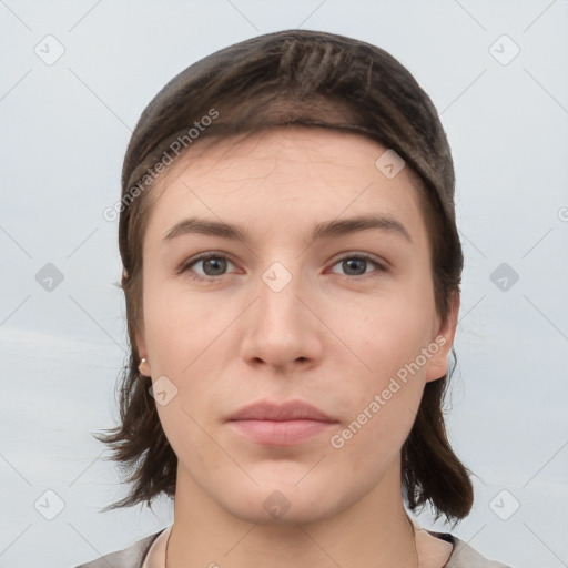 Neutral white young-adult female with medium  brown hair and brown eyes