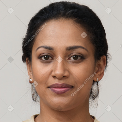 Joyful latino adult female with medium  brown hair and brown eyes