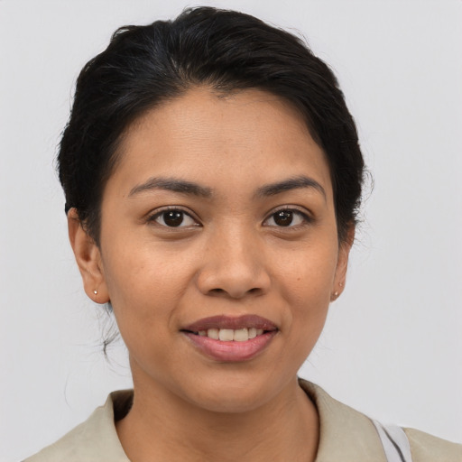 Joyful white young-adult female with short  brown hair and brown eyes