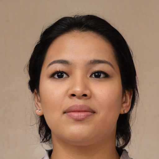 Joyful asian young-adult female with medium  black hair and brown eyes