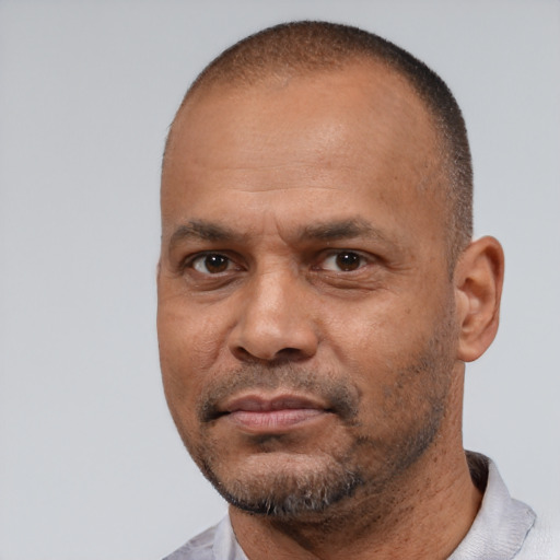 Neutral latino adult male with short  black hair and brown eyes