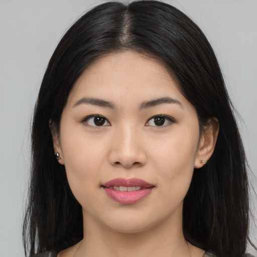 Joyful white young-adult female with long  black hair and brown eyes