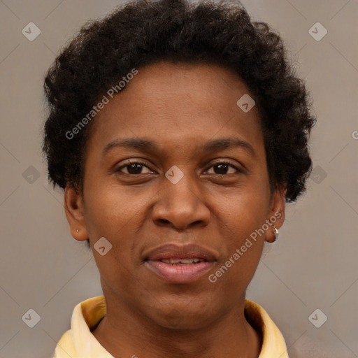 Joyful black adult female with short  brown hair and brown eyes