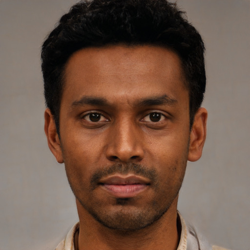 Neutral black young-adult male with short  black hair and brown eyes