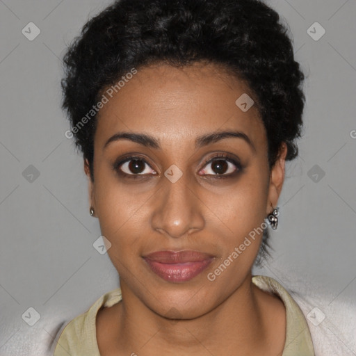 Joyful black young-adult female with short  brown hair and brown eyes