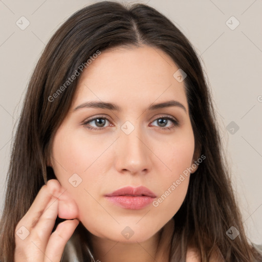 Neutral white young-adult female with long  brown hair and brown eyes