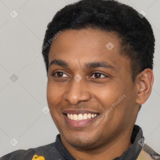 Joyful latino young-adult male with short  black hair and brown eyes