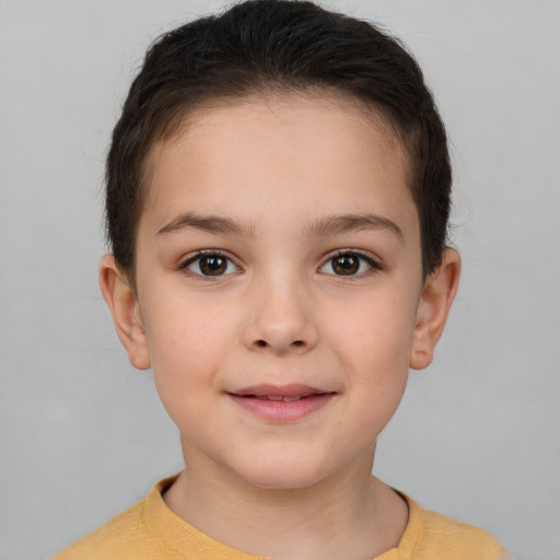 Joyful white child female with short  brown hair and brown eyes