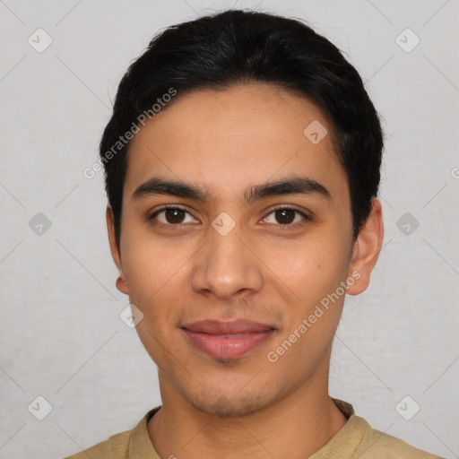 Joyful latino young-adult male with short  black hair and brown eyes