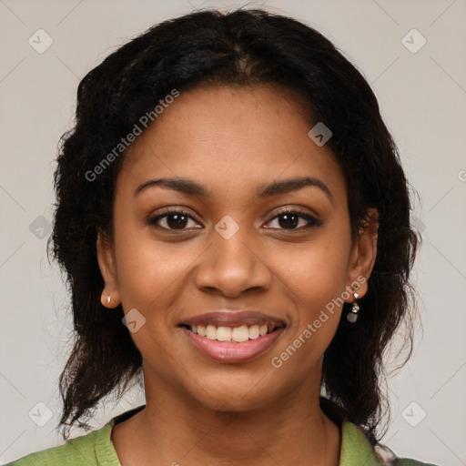 Joyful black young-adult female with medium  black hair and brown eyes