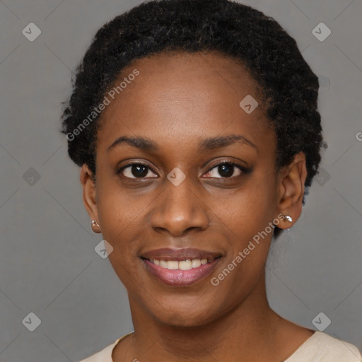 Joyful black young-adult female with short  black hair and brown eyes