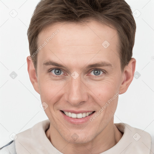 Joyful white adult male with short  brown hair and grey eyes