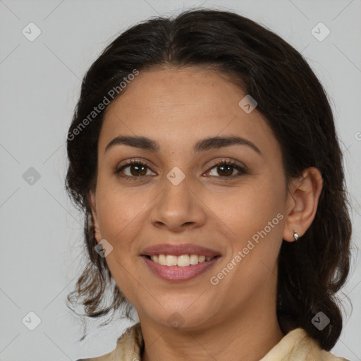 Joyful latino adult female with medium  brown hair and brown eyes