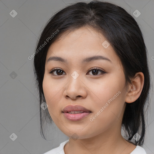 Joyful asian young-adult female with medium  black hair and brown eyes