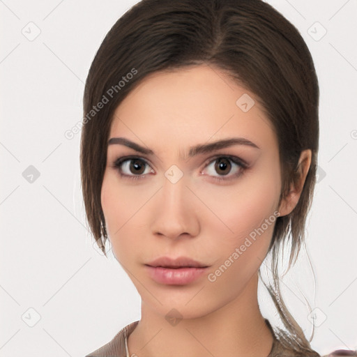 Neutral white young-adult female with medium  brown hair and brown eyes