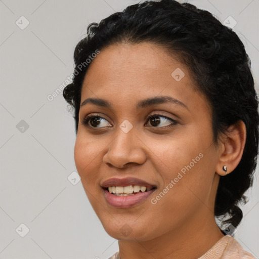 Joyful latino young-adult female with short  black hair and brown eyes