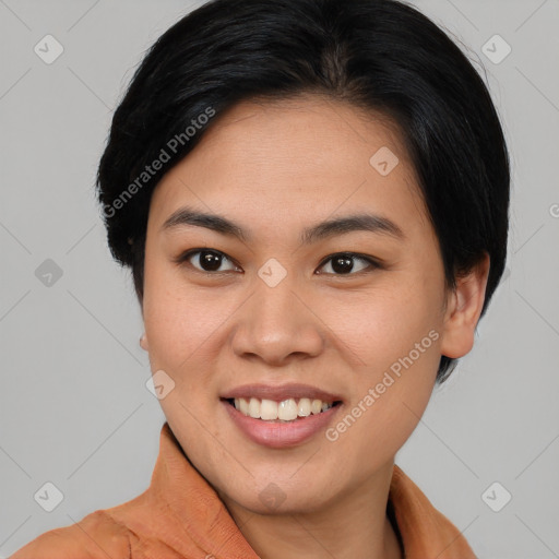 Joyful asian young-adult female with short  brown hair and brown eyes