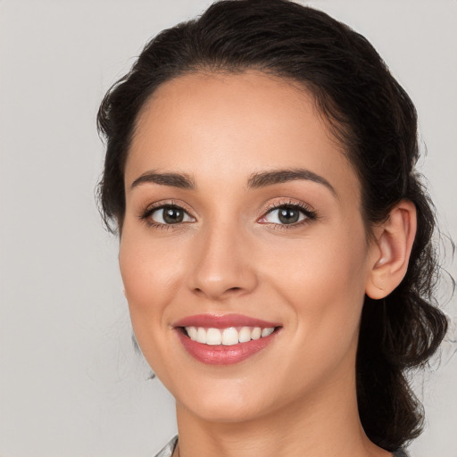 Joyful white young-adult female with medium  brown hair and brown eyes