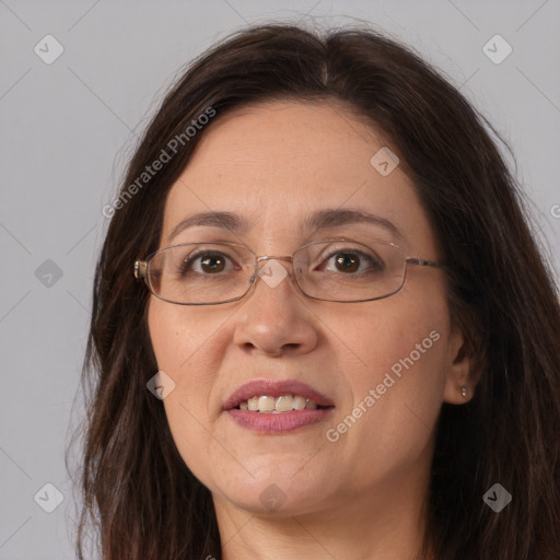 Joyful white adult female with long  brown hair and brown eyes