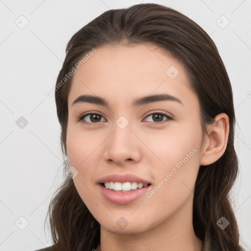 Joyful white young-adult female with long  brown hair and brown eyes