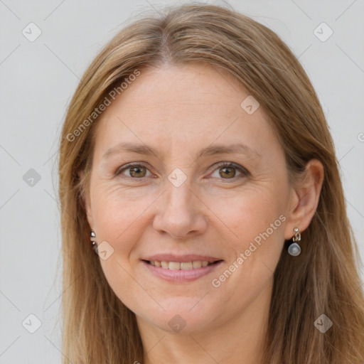 Joyful white adult female with long  brown hair and grey eyes