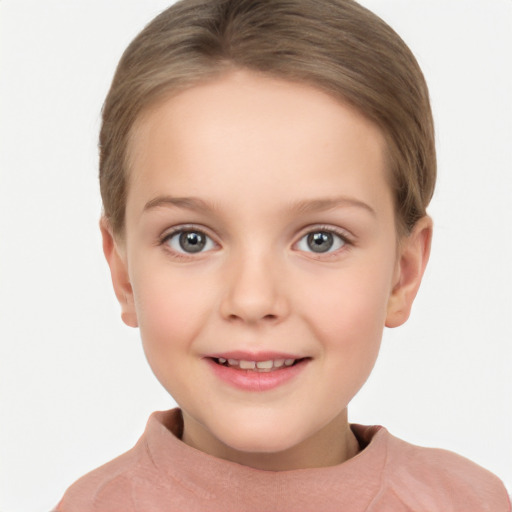 Joyful white child female with short  brown hair and brown eyes