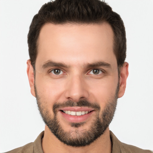 Joyful white young-adult male with short  brown hair and brown eyes