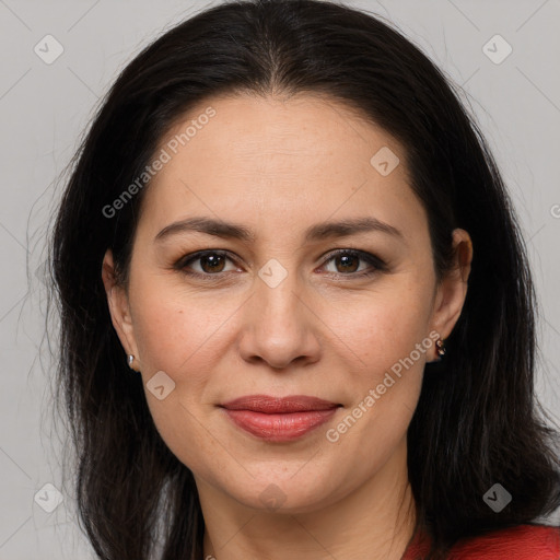 Joyful white adult female with long  brown hair and brown eyes