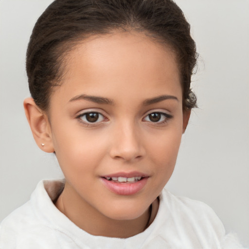 Joyful white child female with short  brown hair and brown eyes