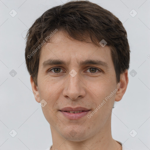 Joyful white adult male with short  brown hair and brown eyes