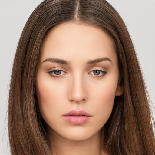 Neutral white young-adult female with long  brown hair and brown eyes