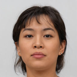 Neutral asian young-adult female with medium  brown hair and brown eyes