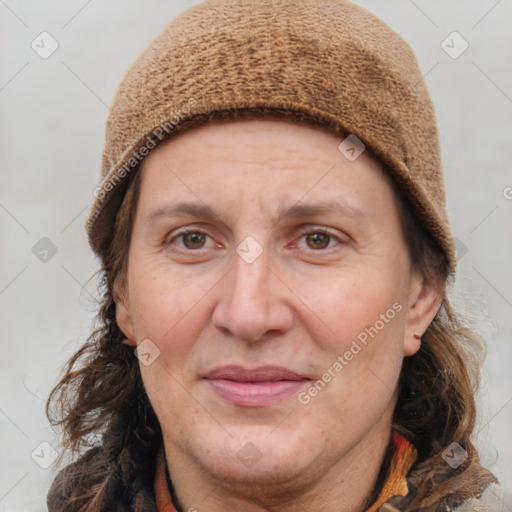 Joyful white adult female with long  brown hair and brown eyes