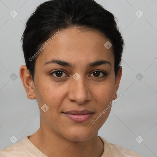 Joyful latino young-adult female with short  brown hair and brown eyes