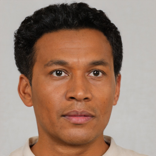Neutral black young-adult male with short  brown hair and brown eyes