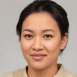 Joyful asian young-adult female with medium  brown hair and brown eyes