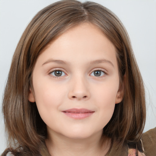 Joyful white child female with medium  brown hair and grey eyes