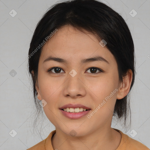 Joyful asian young-adult female with medium  brown hair and brown eyes