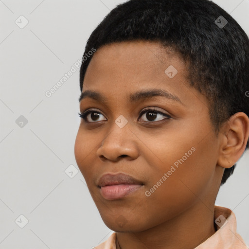 Joyful black young-adult female with short  black hair and brown eyes