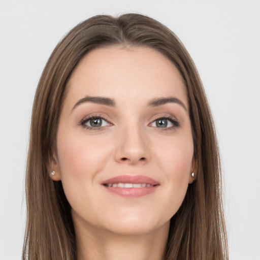 Joyful white young-adult female with long  brown hair and grey eyes