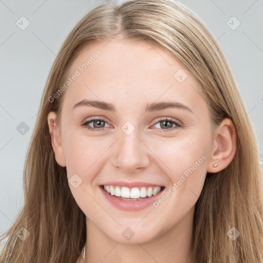 Joyful white young-adult female with long  brown hair and grey eyes