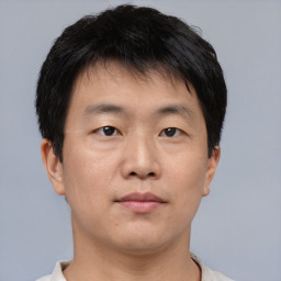 Neutral asian young-adult male with short  brown hair and brown eyes