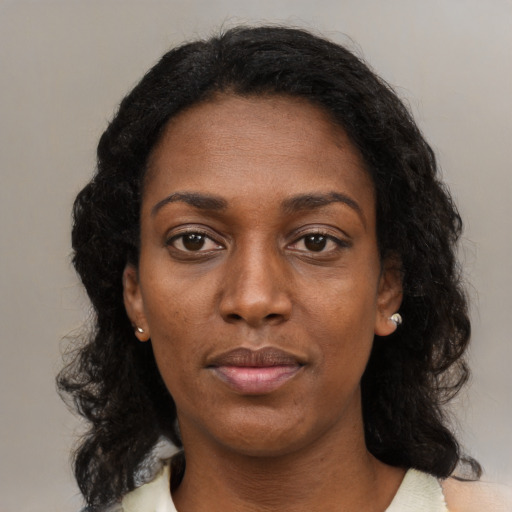 Neutral black young-adult female with medium  black hair and brown eyes