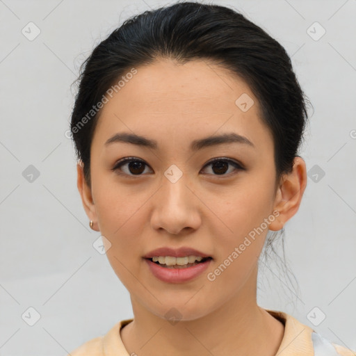 Joyful asian young-adult female with short  brown hair and brown eyes