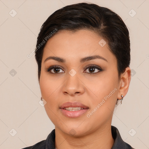 Joyful latino young-adult female with medium  brown hair and brown eyes