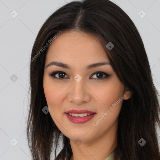 Joyful asian young-adult female with long  brown hair and brown eyes