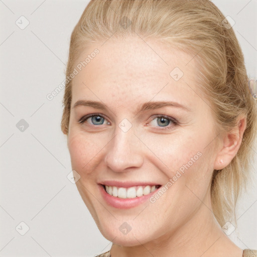 Joyful white young-adult female with long  brown hair and grey eyes