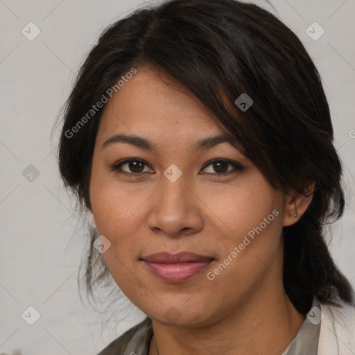 Joyful asian adult female with medium  brown hair and brown eyes