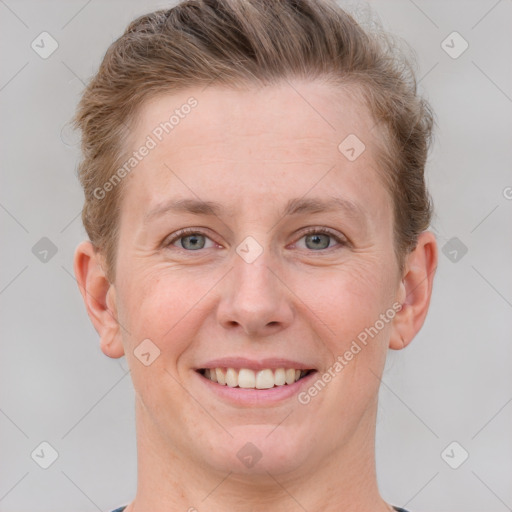 Joyful white young-adult female with short  brown hair and grey eyes