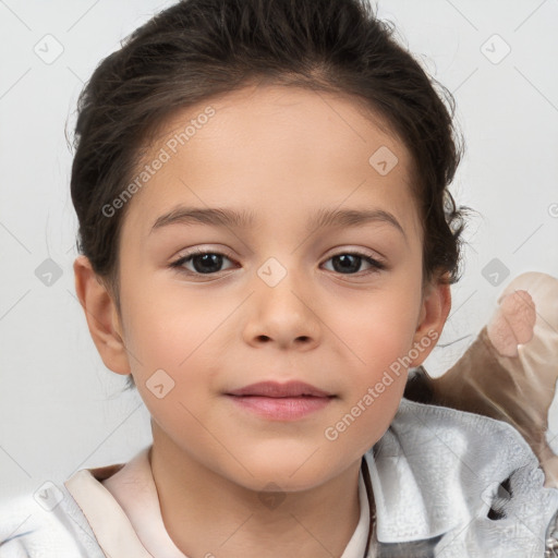 Joyful white child female with short  brown hair and brown eyes